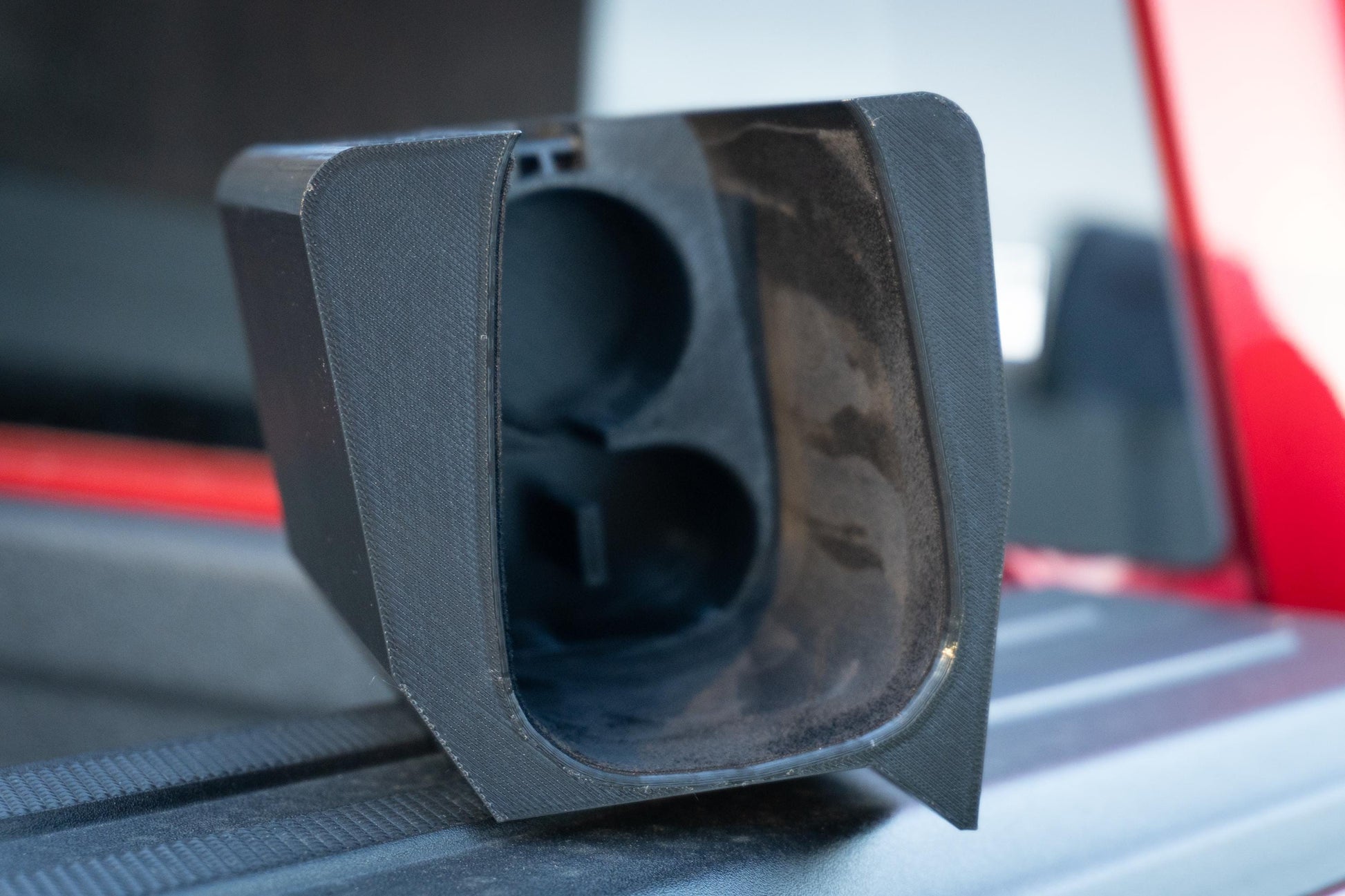 Empty Tesla NACS Adapter Dock showing suede lining